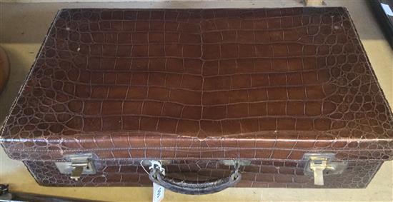 Crocodile skin suitcase